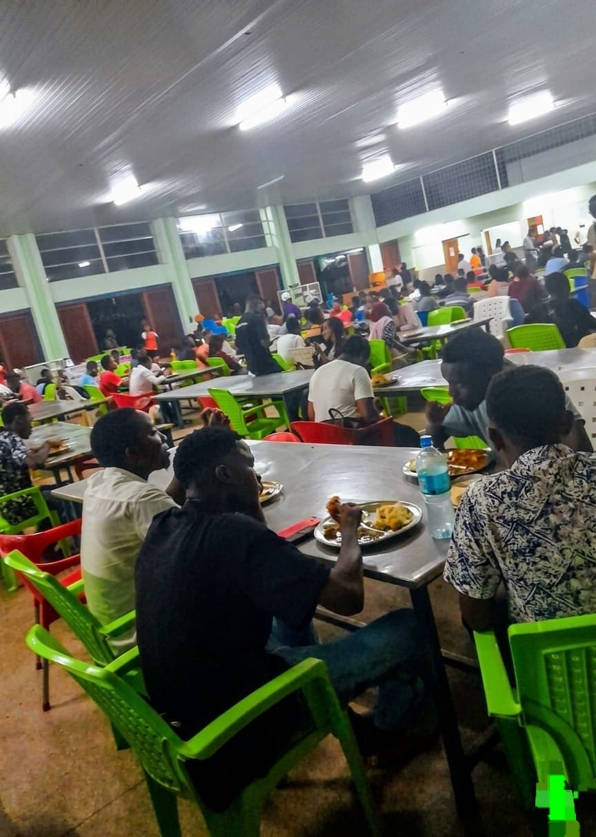 Dining area inside Campus Cafeteria with seating for customers