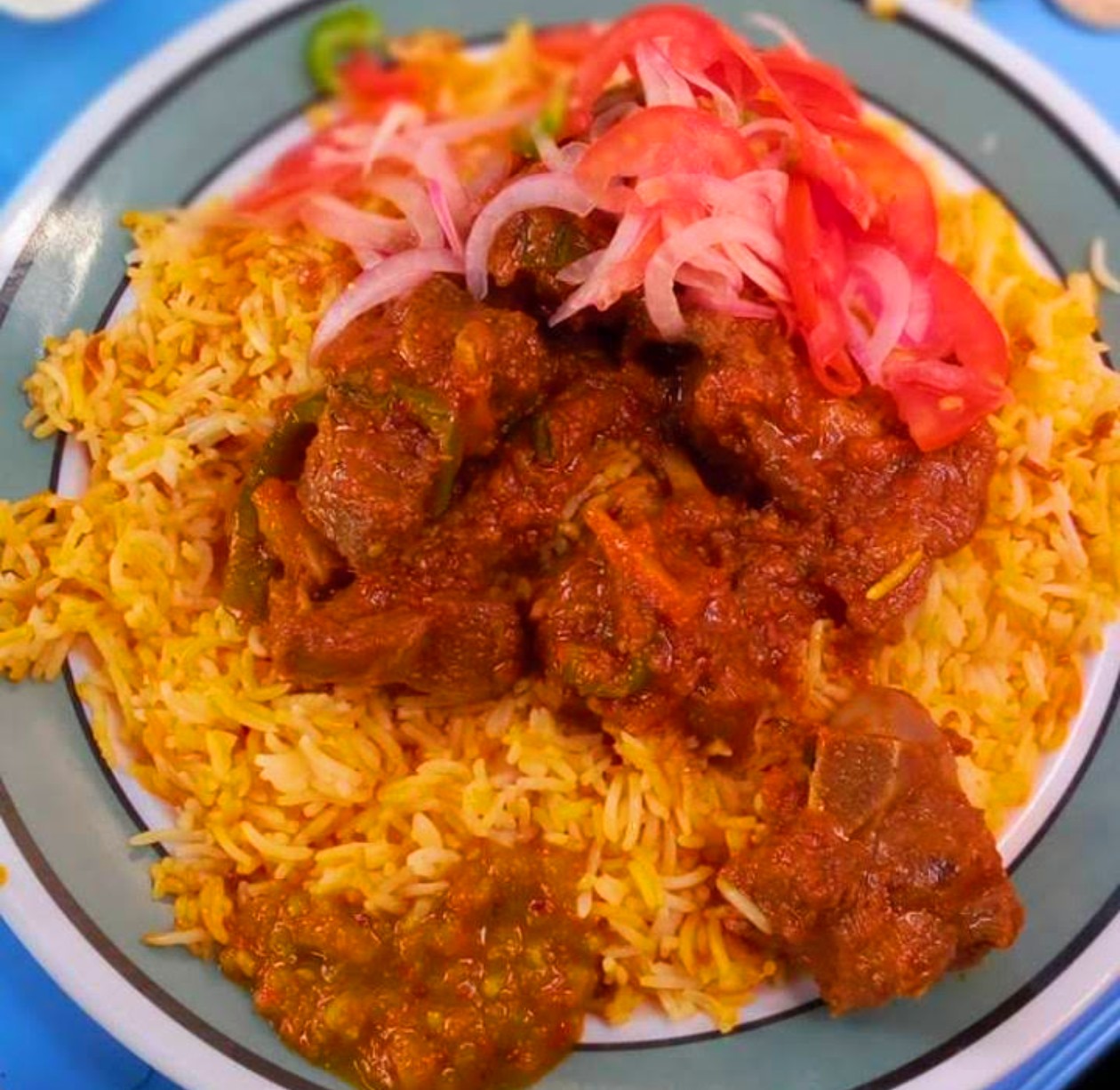 Student ordered meat and pilaf inside Campus Cafeteria at UDSM Main Campus